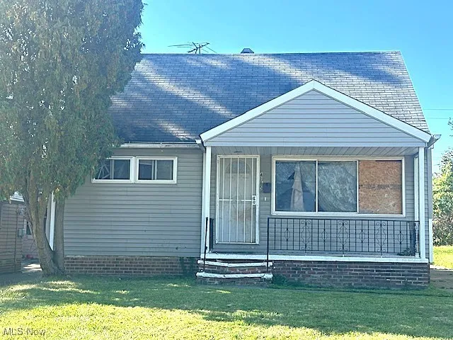 View of front of property with a front lawn