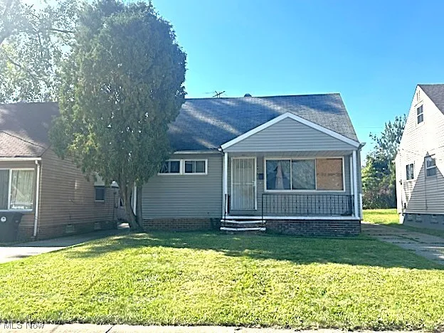 View of front of property with a front lawn