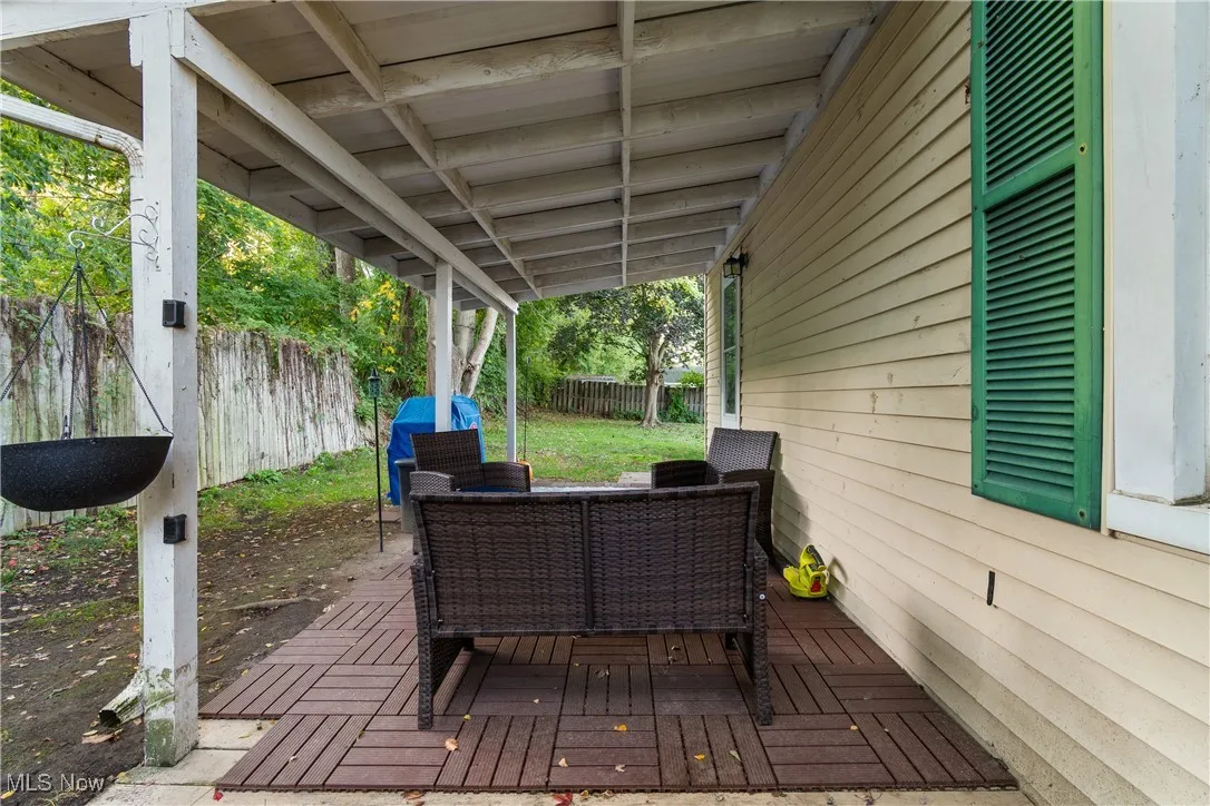 Covered side patio off of kitchen