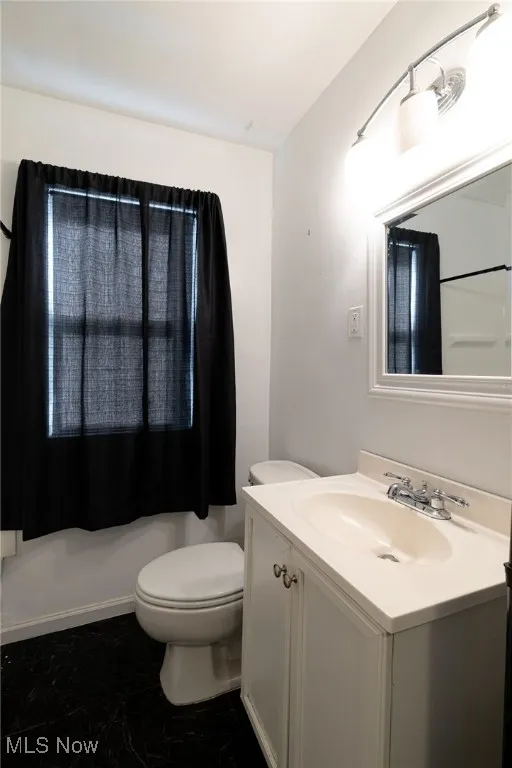 Bathroom with vanity and toilet