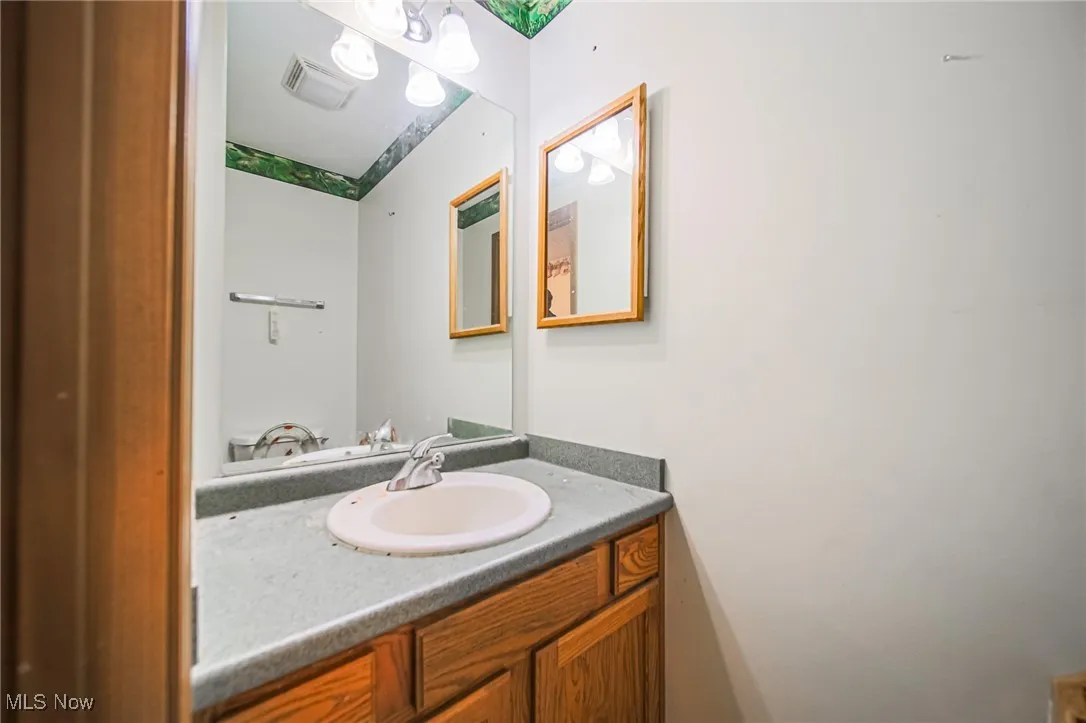 Half bathroom featuring vanity