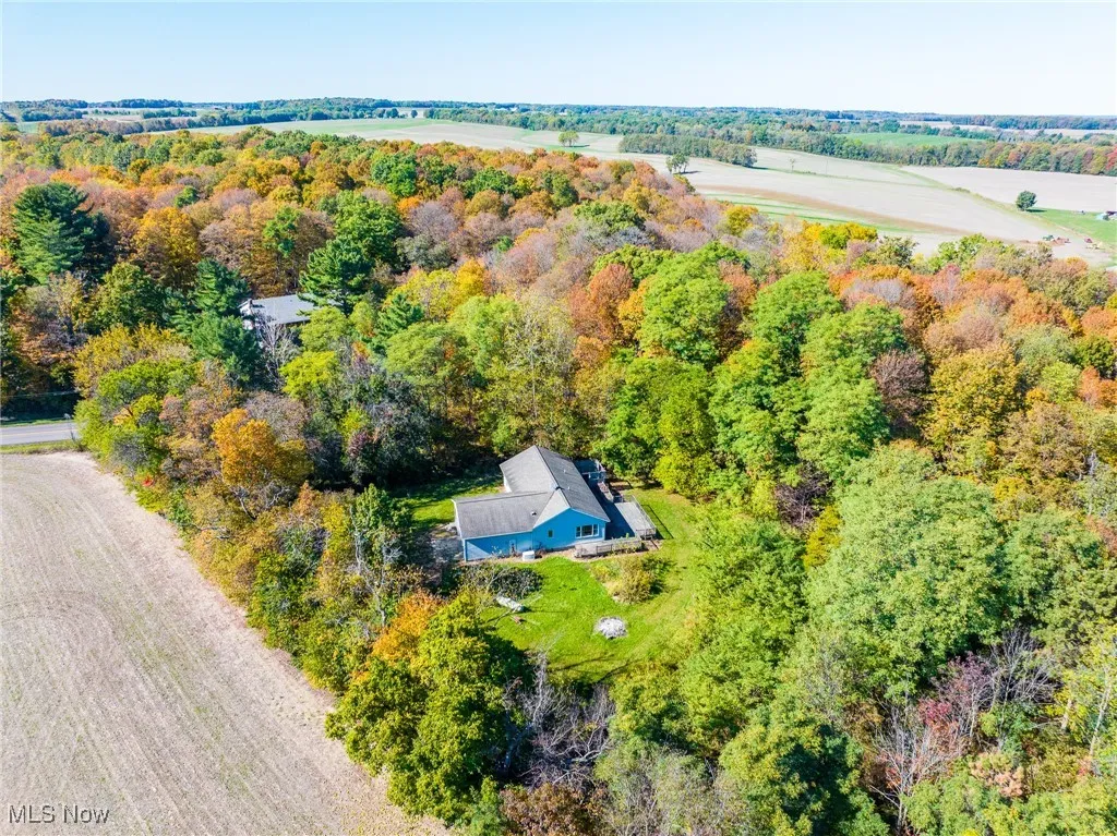 View of property location featuring a heavily wooded area