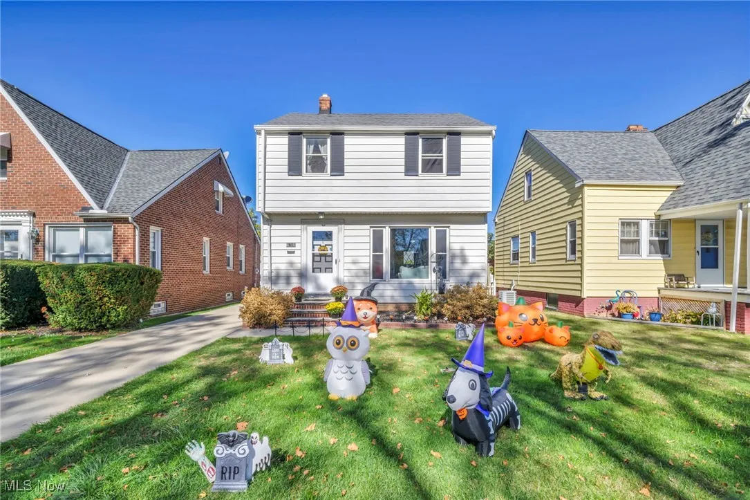 View of front of property with a front lawn and a chimney
