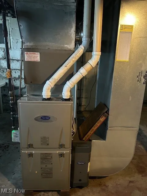 Utility room featuring heating unit