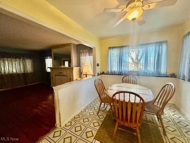 Dining space featuring ceiling fan and wood finished floors