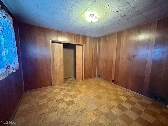 Empty room with wood walls