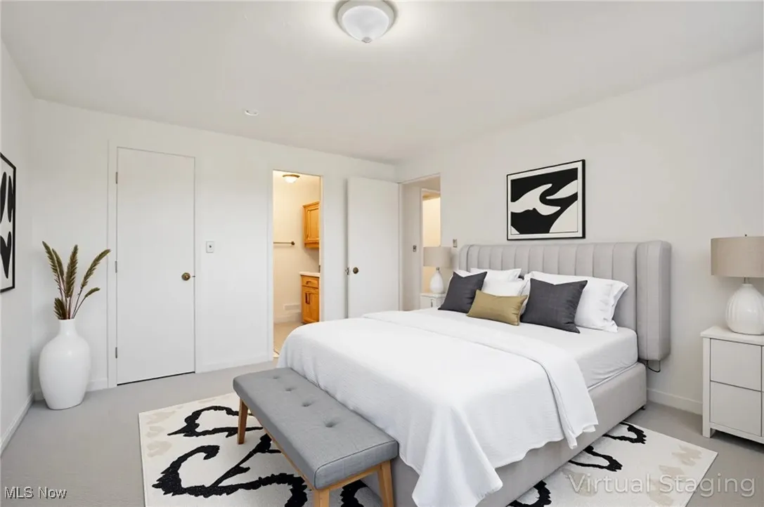staged primary bedroom and ensuite 1/2 bathroom