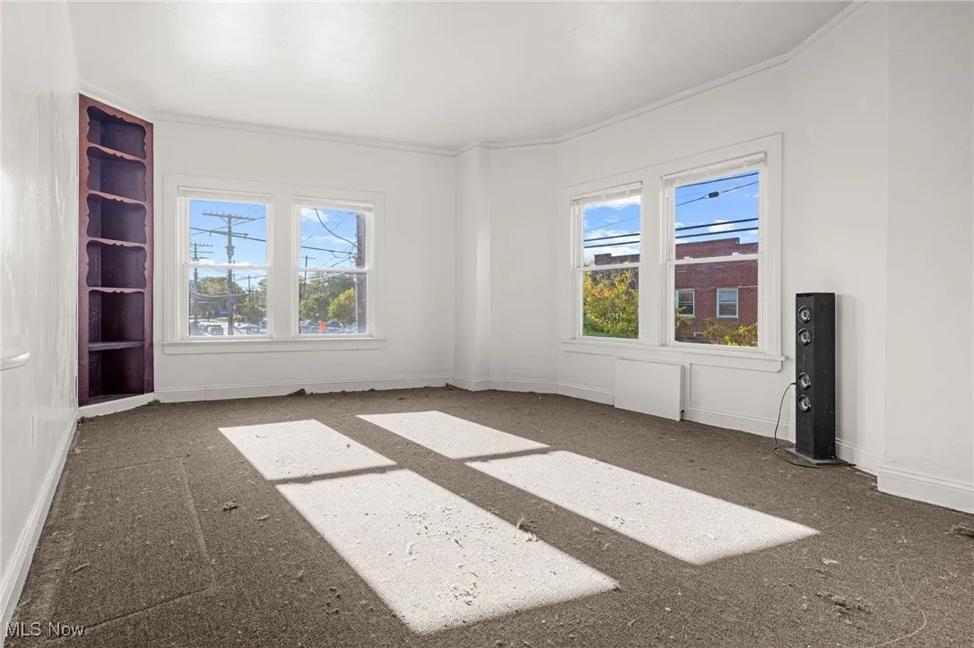 Unfurnished room featuring ornamental molding