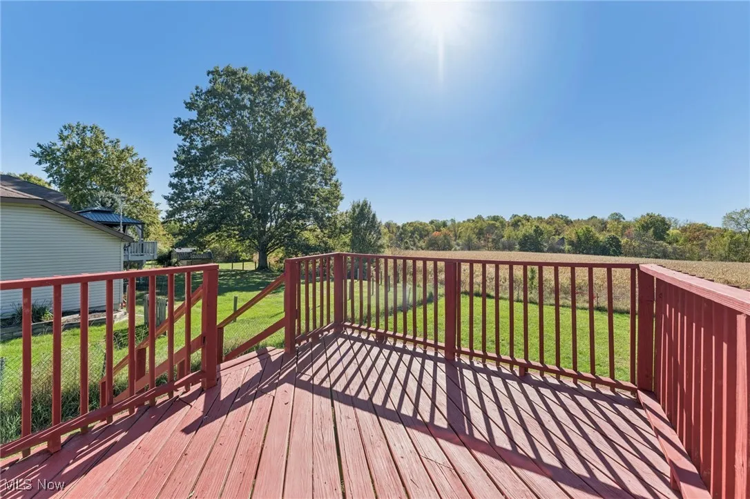 Deck featuring a lawn