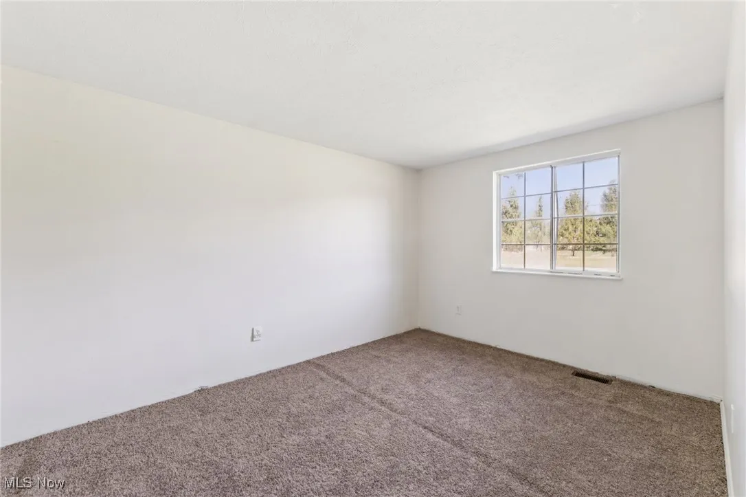 Empty room featuring carpet
