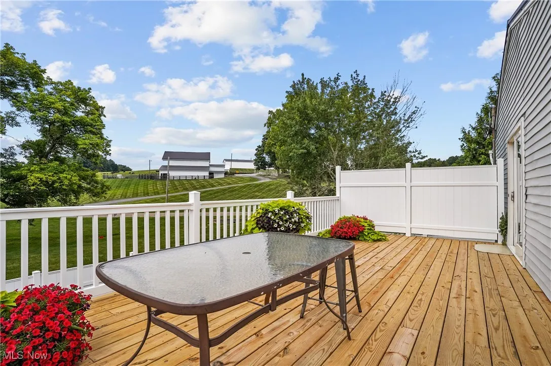 Wooden deck featuring outdoor dining space