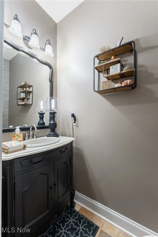 Bathroom with vanity and light tile patterned floors