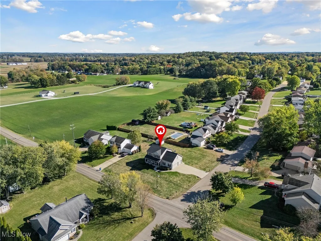 View of property location with nearby suburban area