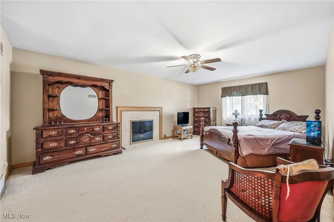Bedroom featuring carpet flooring and a ceiling fan