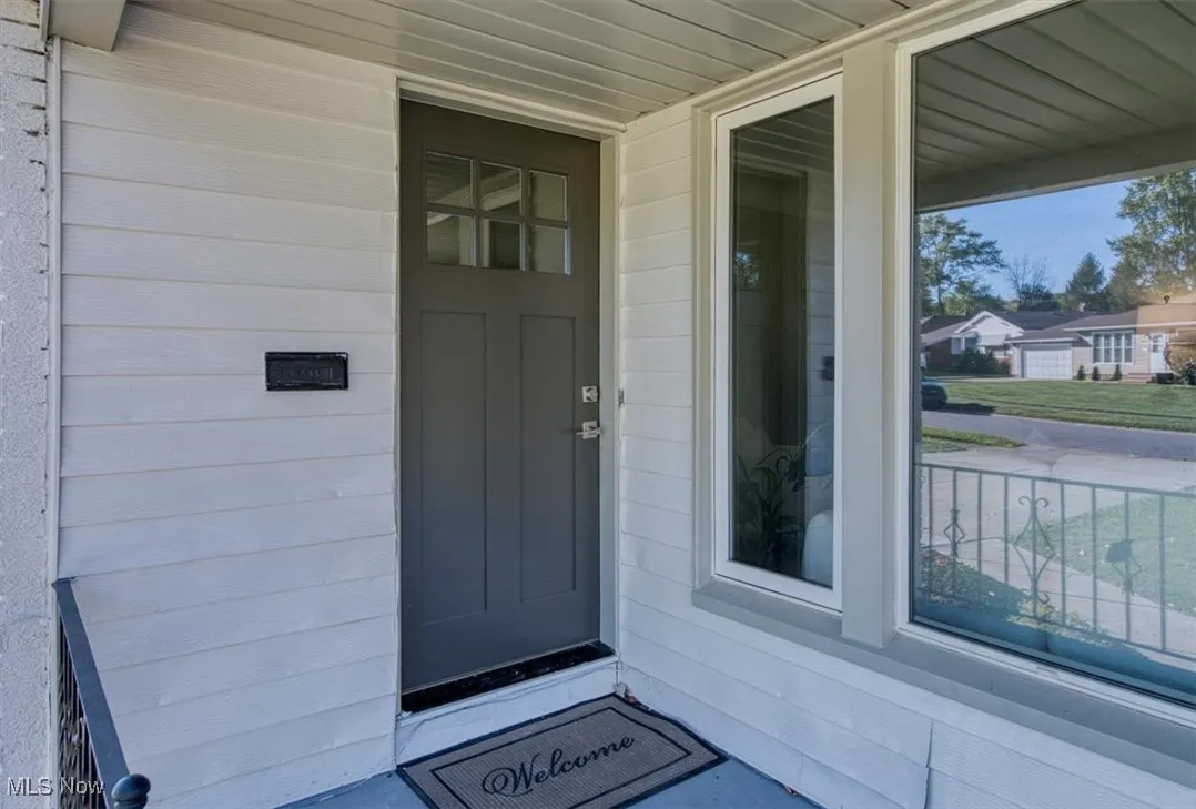 Property entrance with covered porch
