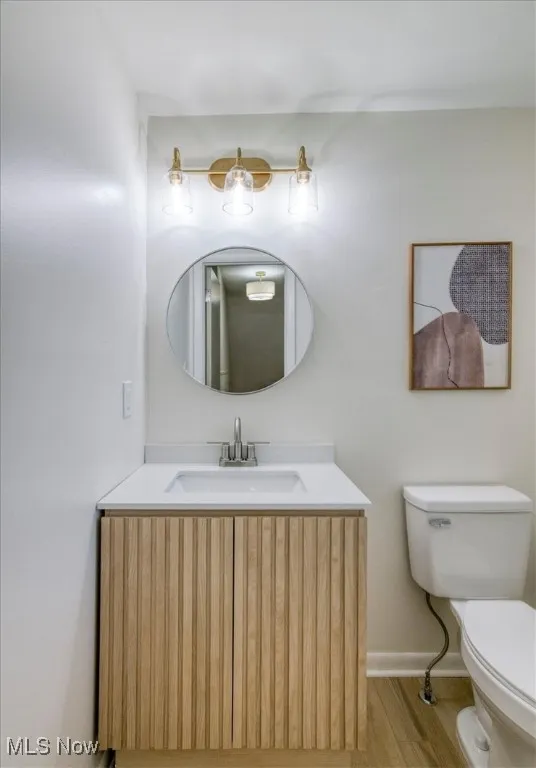 Bathroom with vanity and light wood-style floors