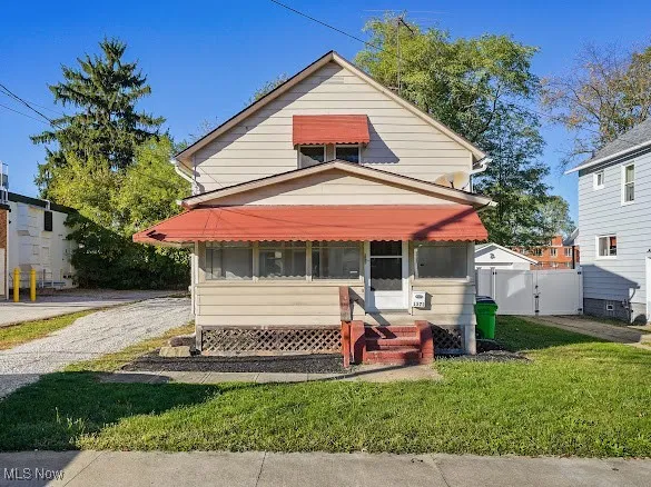 View of front of house featuring a front yard and entry steps