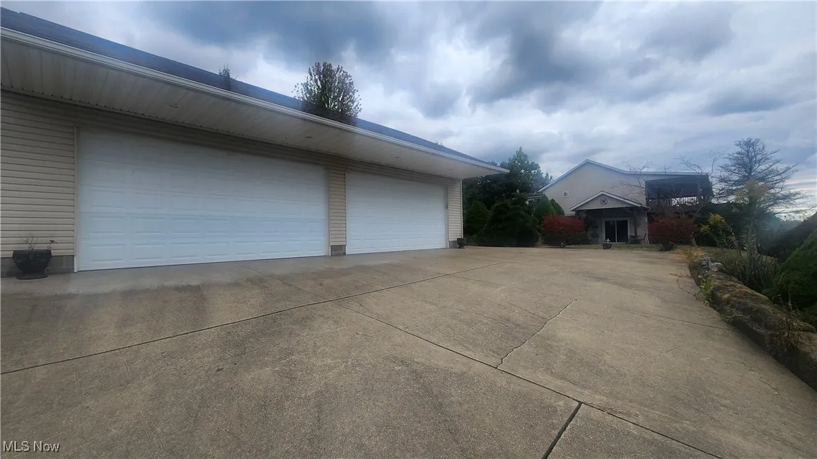View of garage and house