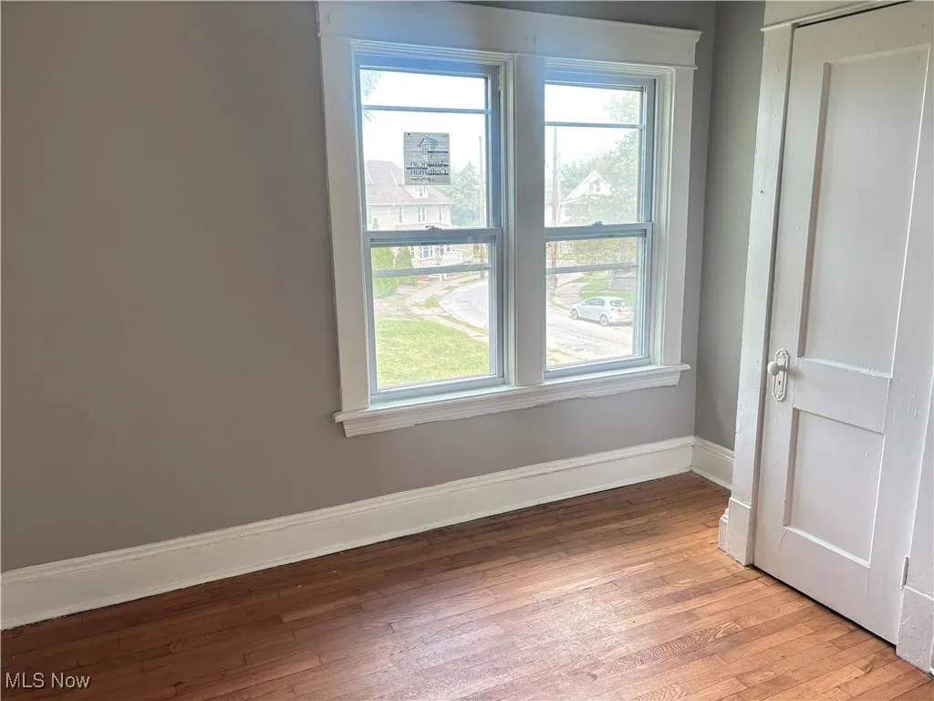 Unfurnished room with wood-type flooring
