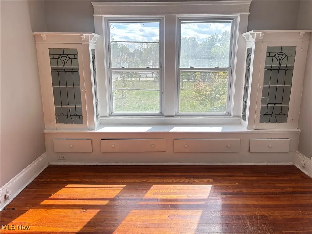 Detailed view of baseboards and wood finished floors