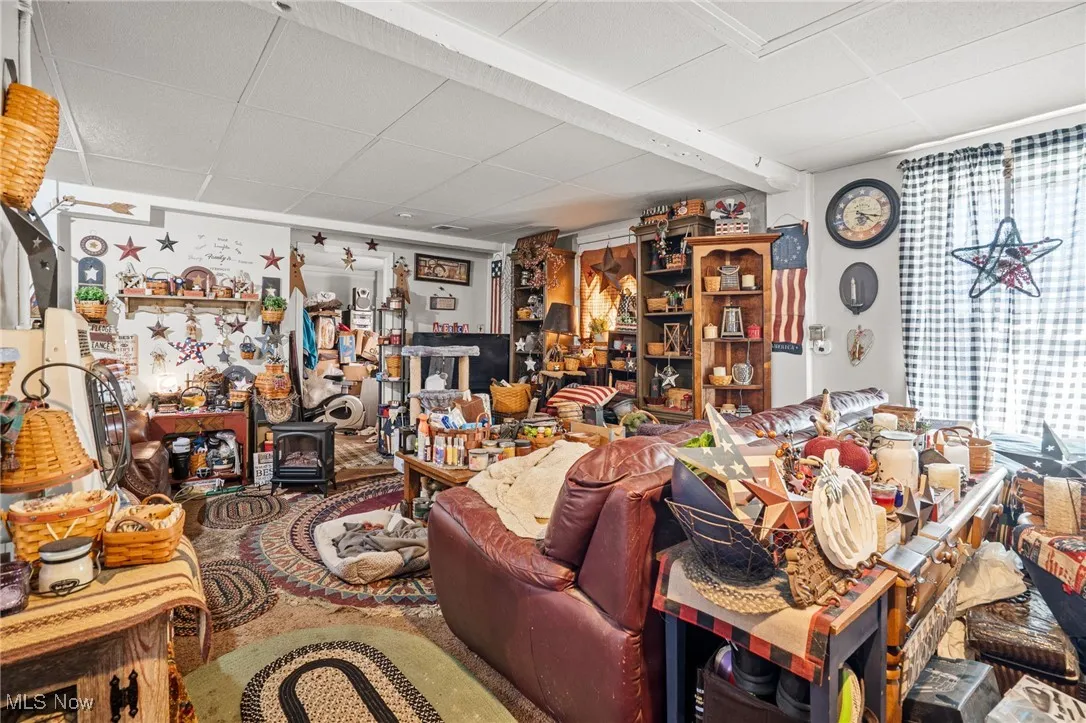 Living room featuring a drop ceiling