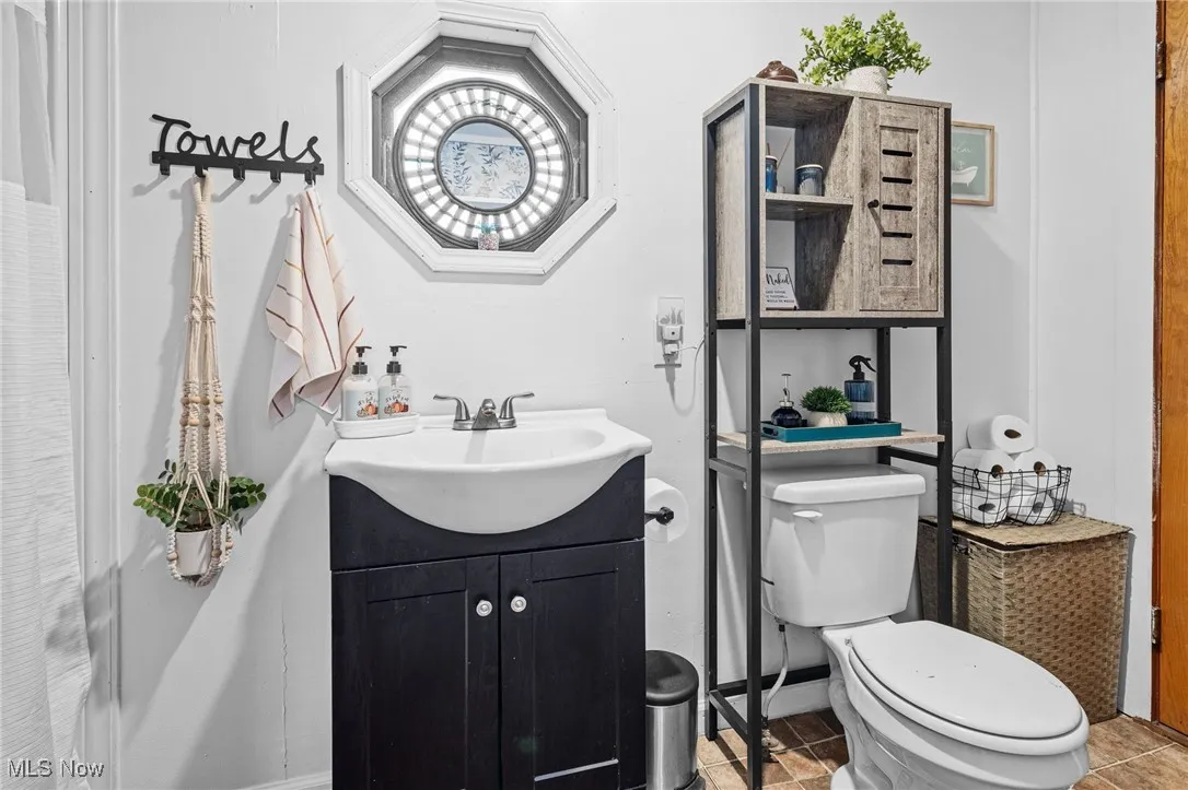 Bathroom featuring vanity and tile patterned floors