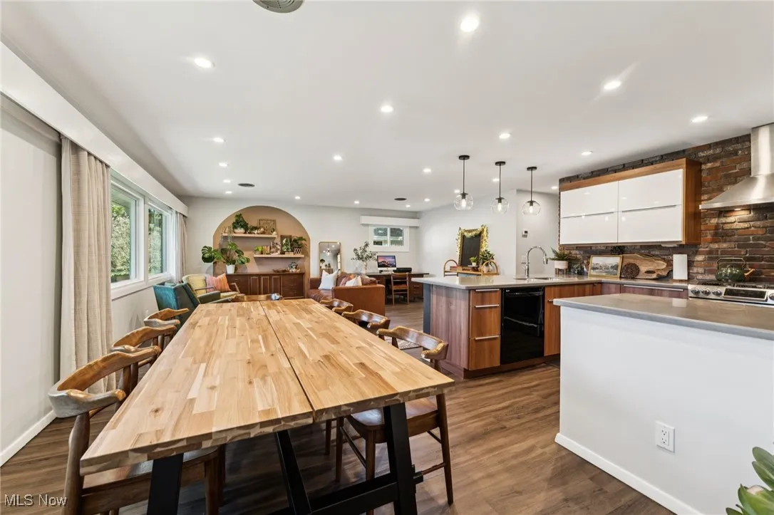 Dining area featuring dark wood finished floors and recessed lighting