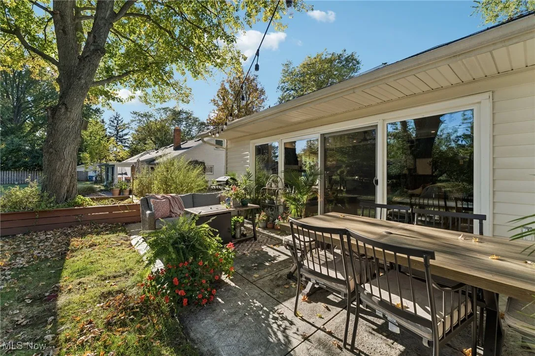 View of patio / terrace with outdoor dining area and a wooden deck