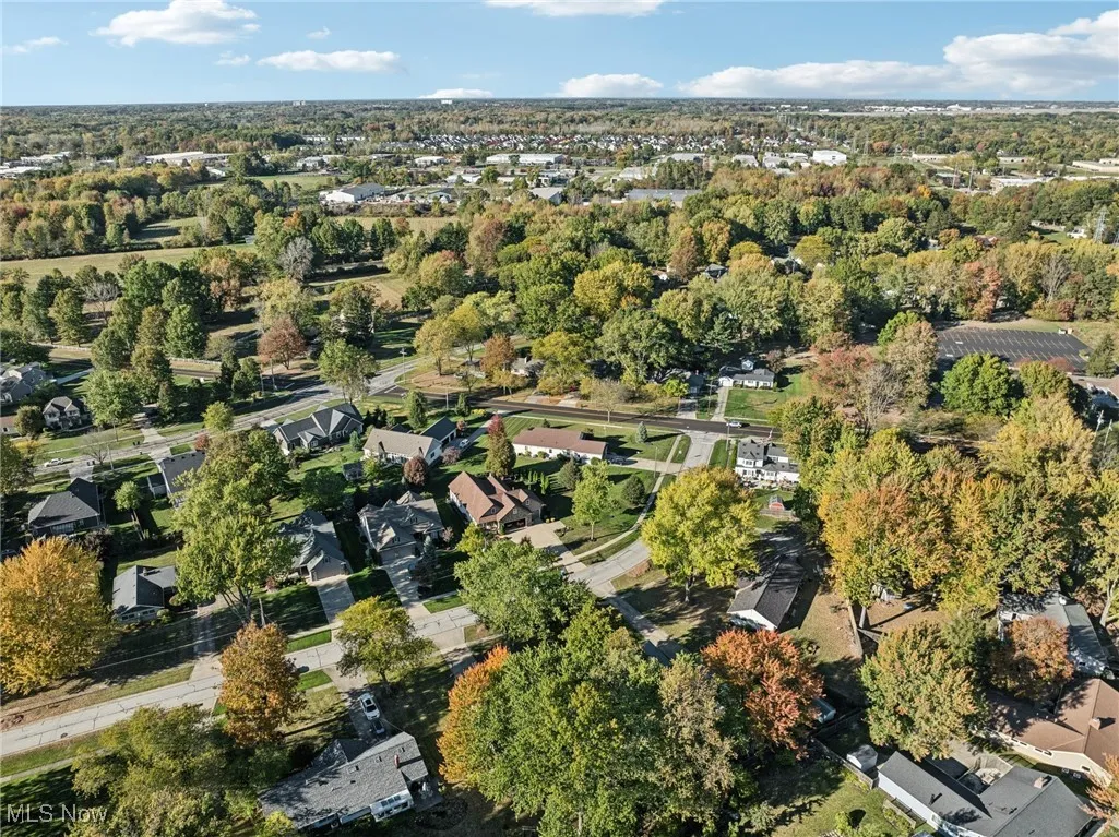 Aerial view of property's location featuring nearby suburban area