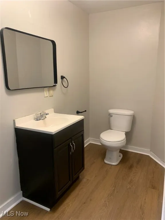 Bathroom with vanity and light wood finished floors