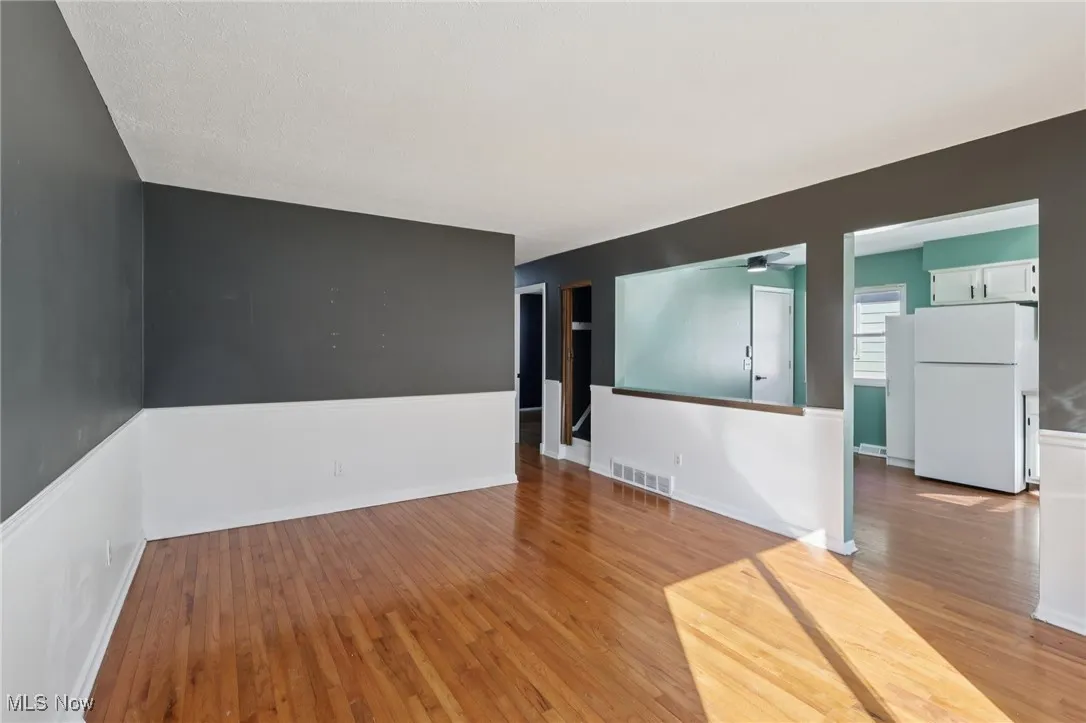 Empty room featuring light wood-type flooring and baseboards