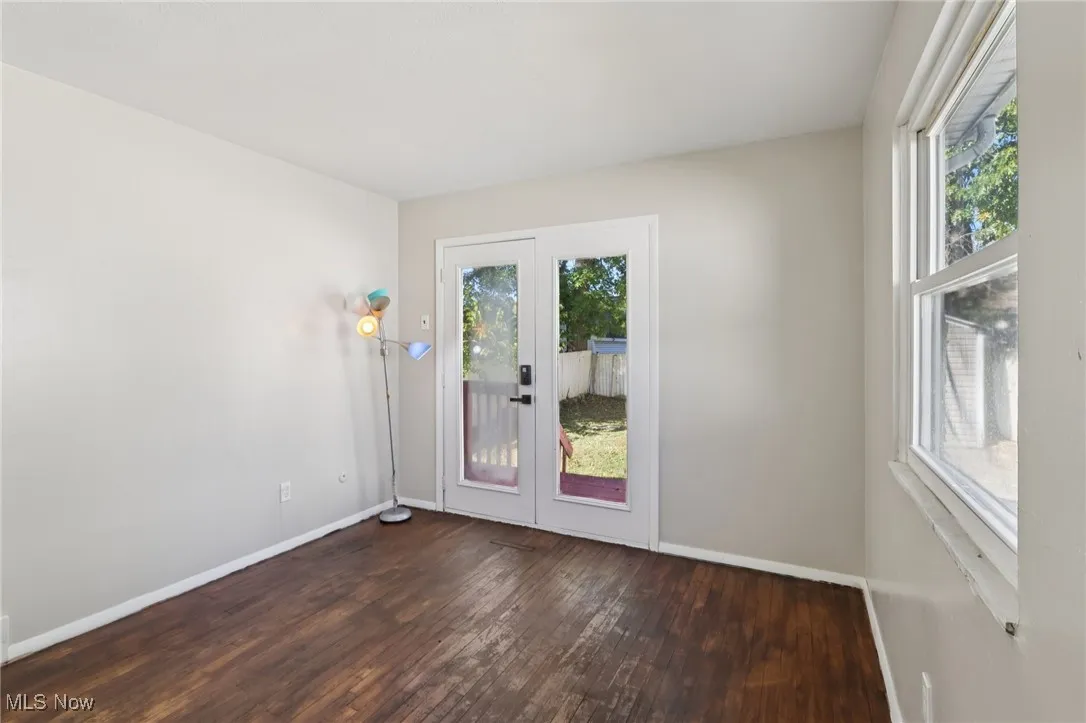 Doorway to outside with wood-type flooring and french doors