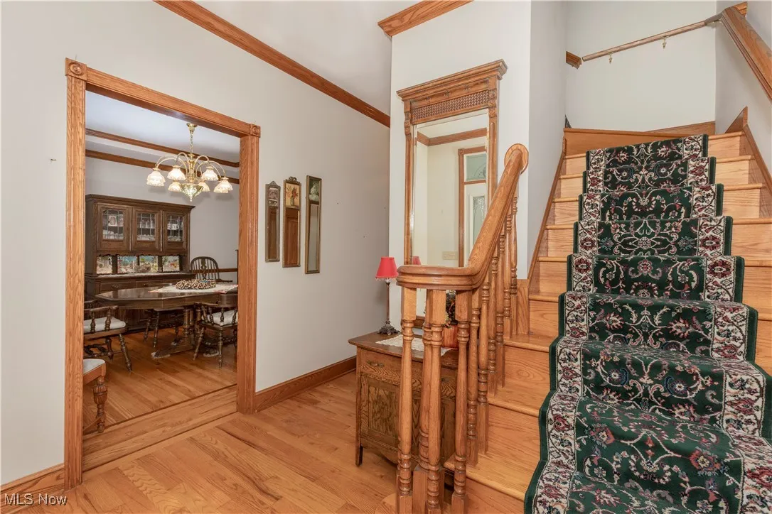 Details like crownmolding, trimwork and wooden staircase are classic and beautiful.