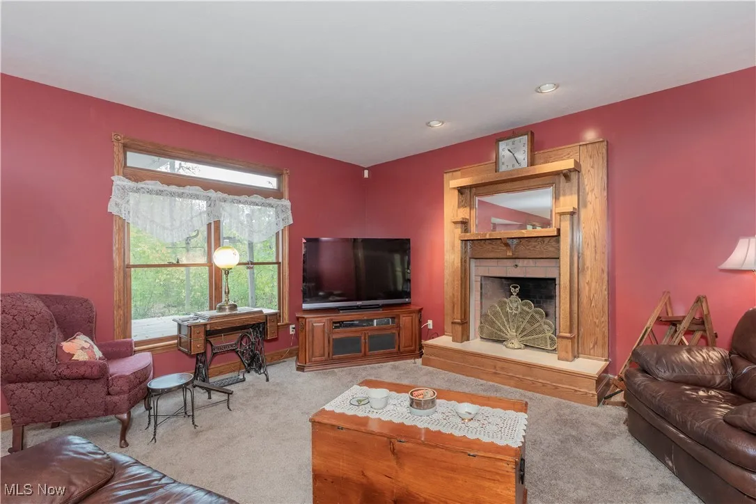 Bright living room that connects to office and kitchen.