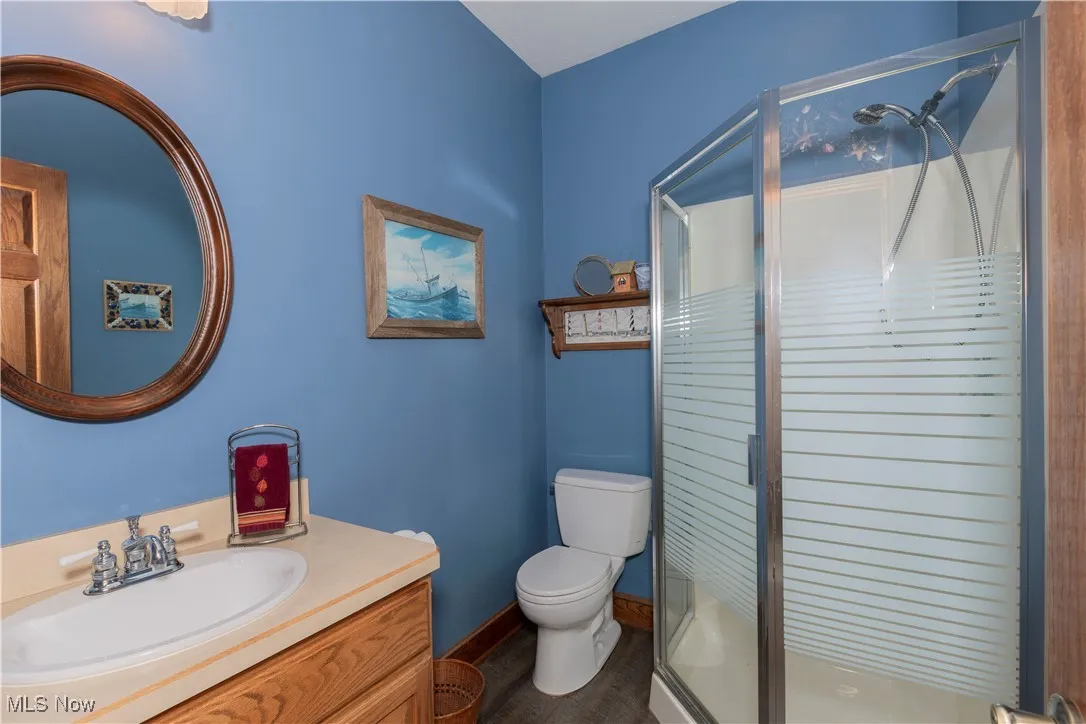 Full bathroom on the first floor off back garage door.