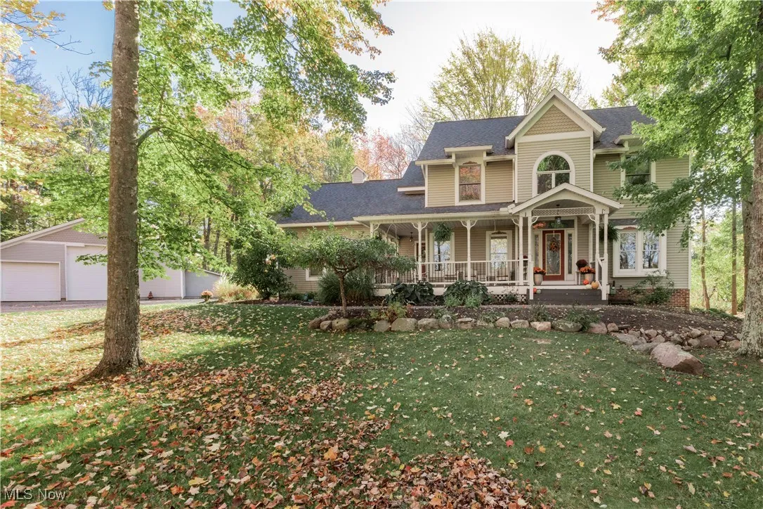 Beautiful property and home with spacious yard and outbuilding/ garage.