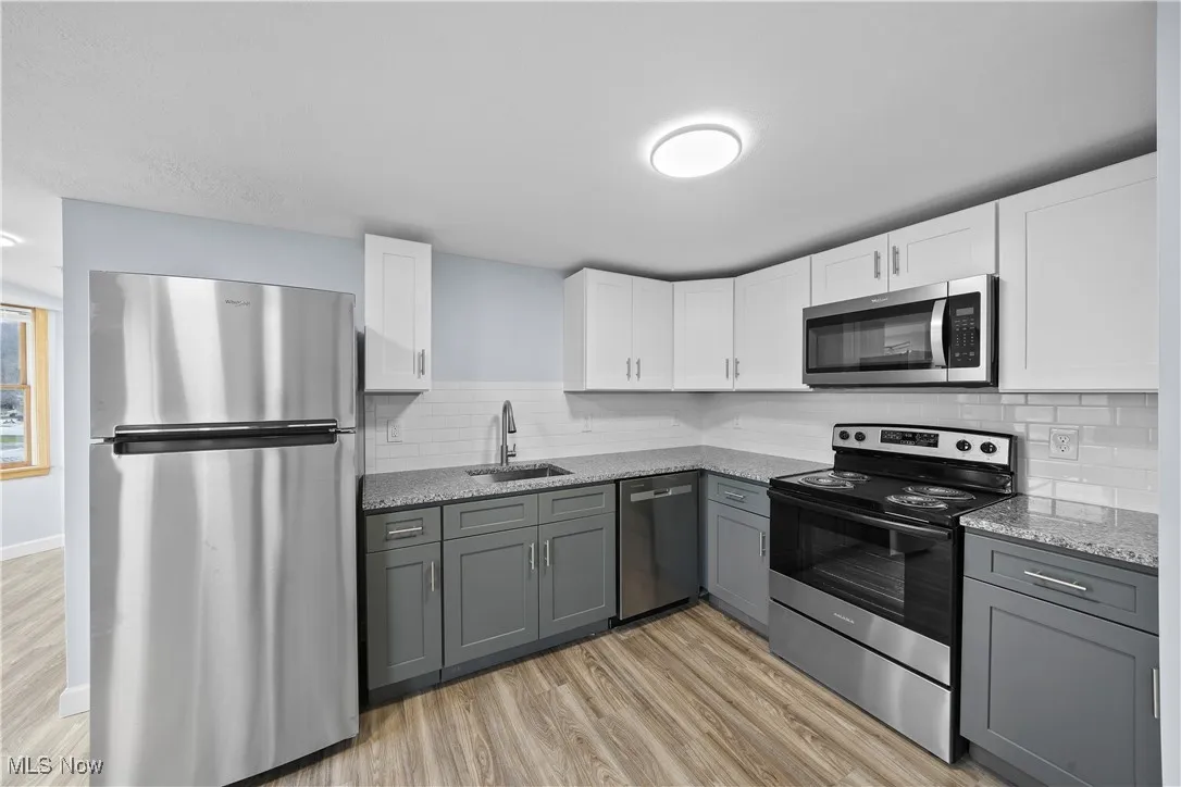 1735 Merriman Rd #301 Akron, OH 44313 Welcomes you to Trails Edge in the Valley! This stunning brand-new 1 bedroom & 1 bathroom suite offers modern living with in-unit laundry with washer and dryer, all kitchen appliance including stove, microwave, refrigerator, dishwasher plus granite countertops, and luxury vinyl plank flooring throughout. Enjoy the convenience of high-speed internet and streaming, keyless door entry to the building as well as your separate suite, and stylish brand new finishes throughout. Tenant pays electric and water monthly billed on about the 15th of each month for actual useage as well as a $30 fee for the streaming hookups, tenant provides their own router. Be the very first to call one of these beautiful suites home—ready for immediate move-in!