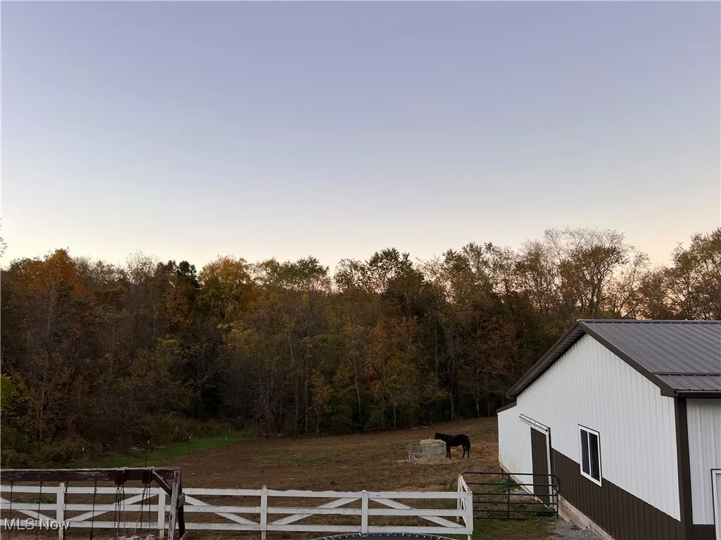 Pasture and fencing for horse. Side of new bldg