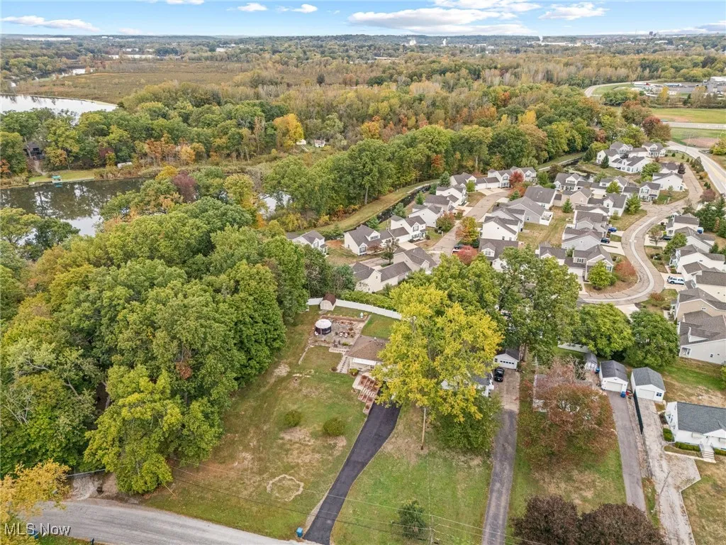 Aerial overview of property's location with nearby suburban area