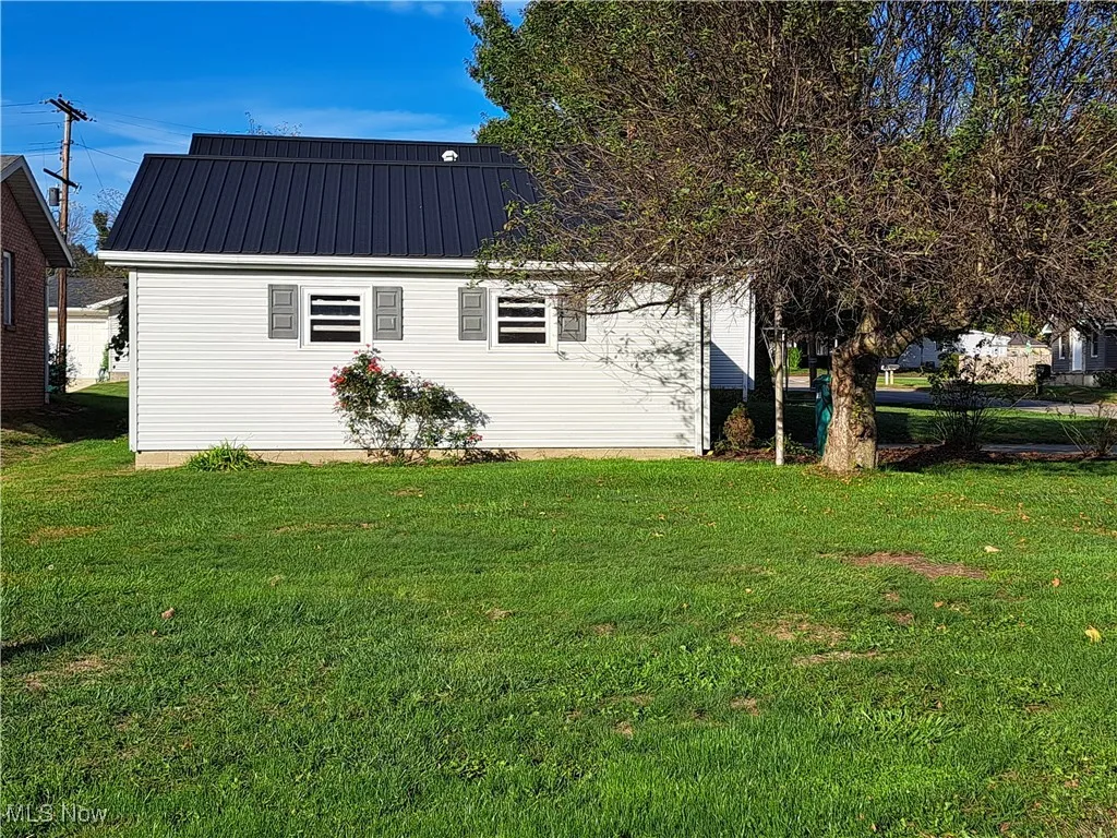Side of garage with large yard