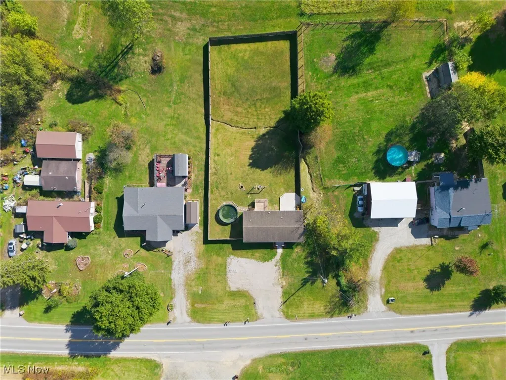 Aerial overview of property's location with rural landscape and agricultural land