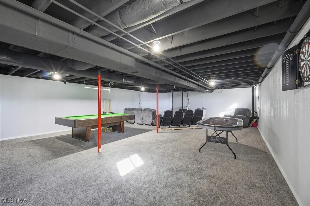 Finished below grade area with pool table and carpet