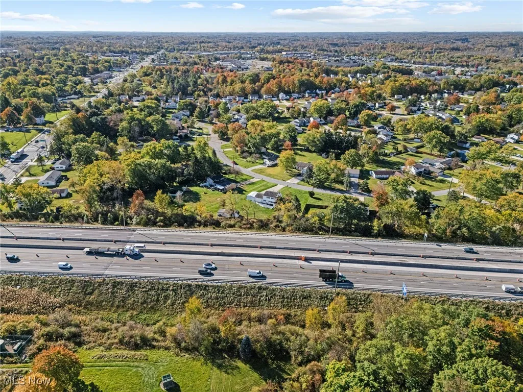 Aerial view of property's location featuring a main thoroughfare