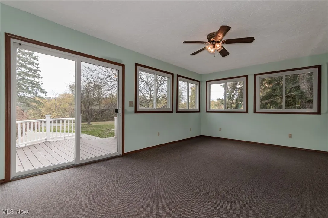 Sunroom Retreat – Enjoy year-round views of your private backyard oasis.