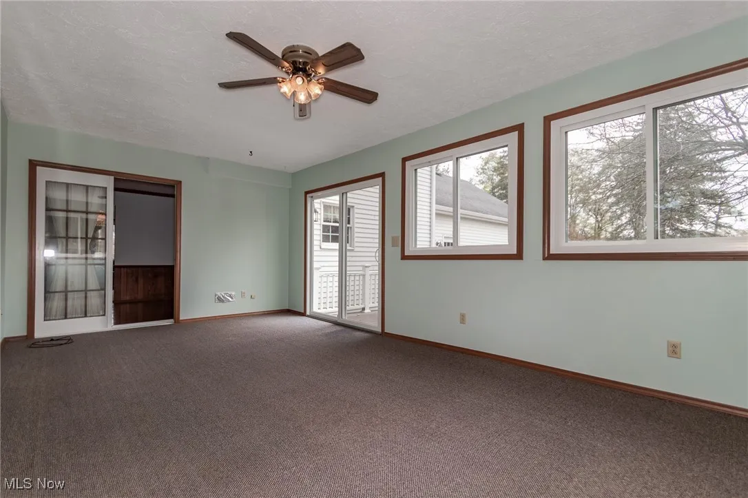 Sunroom Retreat – Enjoy year-round views of your private backyard oasis.