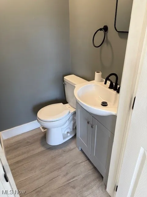 Bathroom featuring light wood-type flooring and vanity