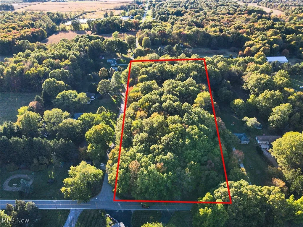 Aerial overview of property's location featuring property parcel outlined