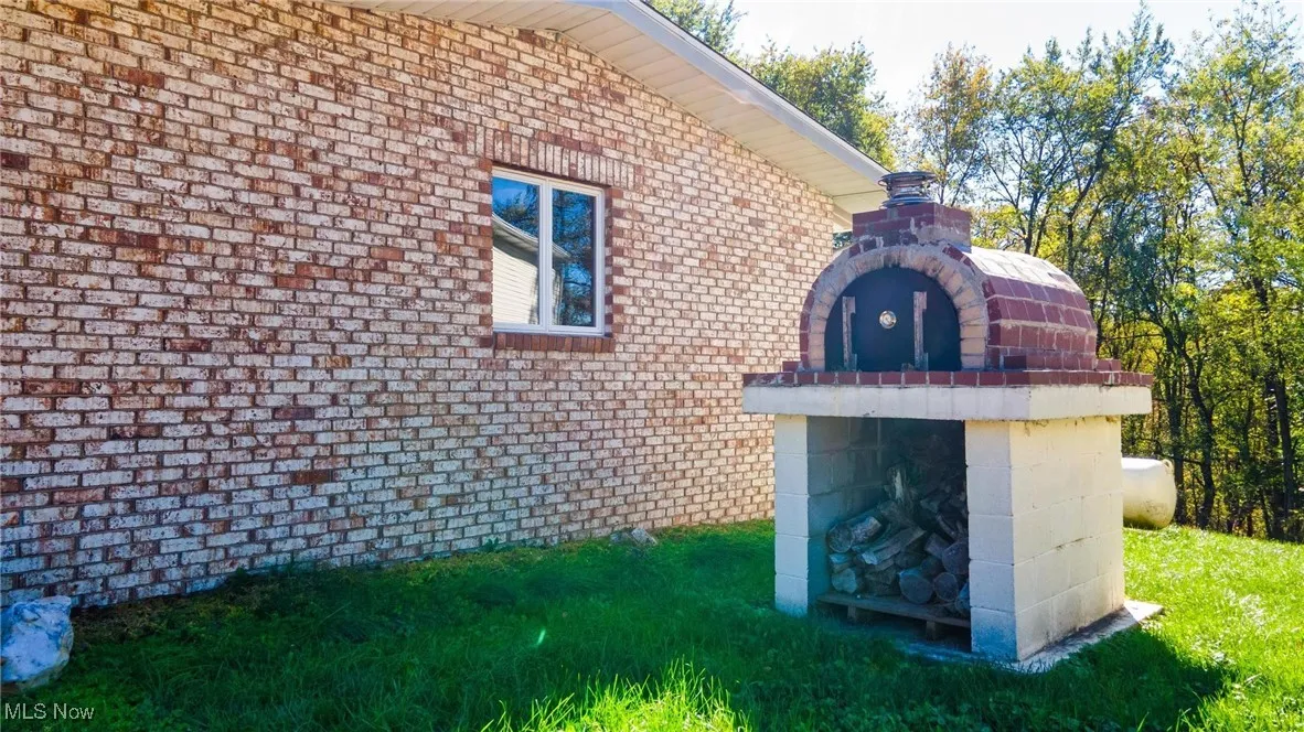 View of side of property featuring brick siding