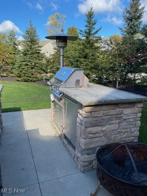 View of patio with area for grilling