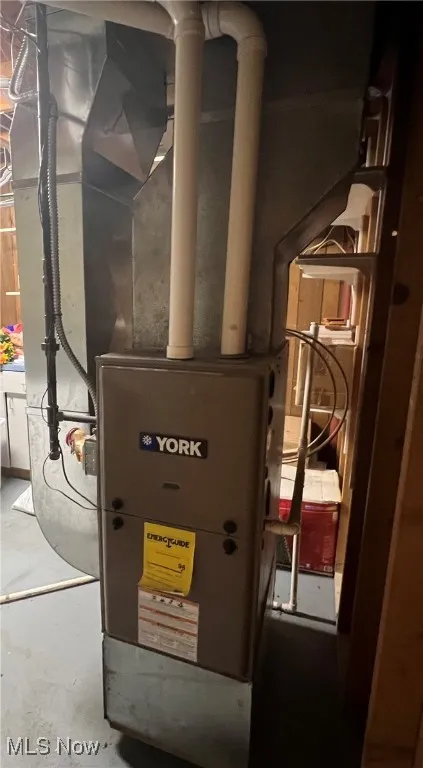 Utility room featuring heating unit